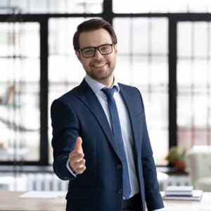 Image showing a smiling man in a suit with his hand forward ready to greet someone